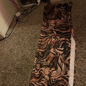 Very long, has a slit going down the left leg